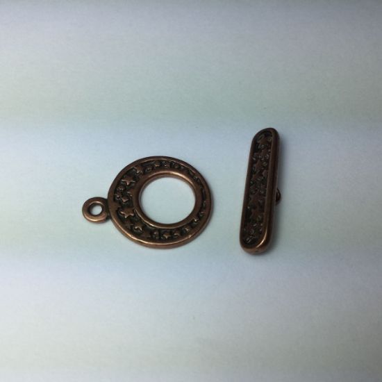 Picture of Clasp toggle antiqued copper-plated pewter (tin-based alloy) 17.5mm go-go with star design.