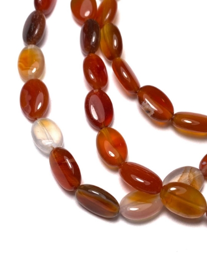 Picture of Red Agate Puff Oval bead 12x8mm x40cm