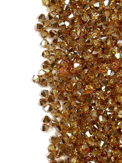 Picture of Swarovski 5328 Xilion Bead 4mm Crystal Metallic Sunshine x100