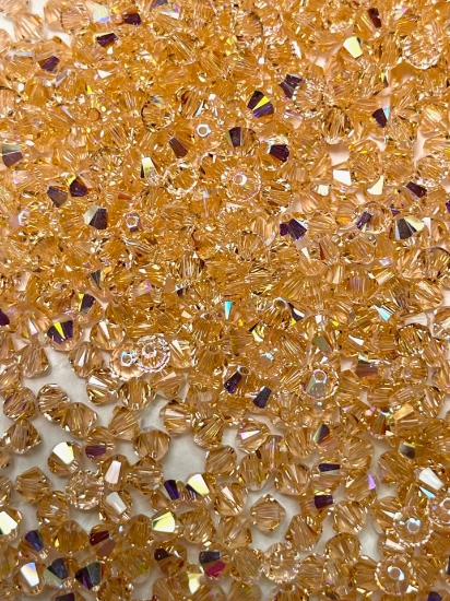 Picture of Swarovski 5328 Xilion Bead 4 mm Light Peach AB x100