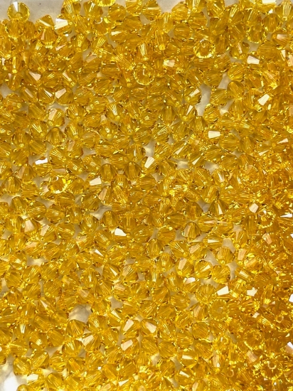 Picture of Swarovski 5328 Xilion Bead 4mm Light Topaz x100