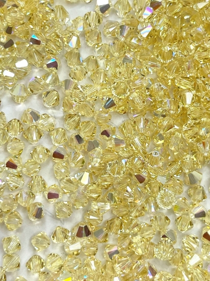 Picture of Swarovski 5328 Xilion Bead 4mm Jonquil AB x100