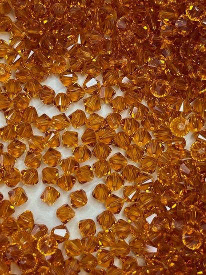 Picture of Swarovski 5328 Xilion Bead 4 mm Topaz x100