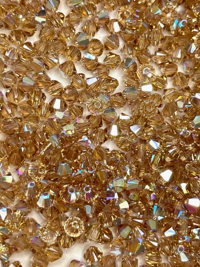 Picture of Swarovski 5328 Xilion Bead 4mm Light Colorado Topaz AB x100