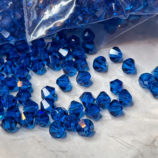 Picture of Swarovski 5328 Xilion Bead 4 mm Capri Blue x100