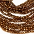 Picture of Faceted Rondelle bead 1,5x2mm Dark Gold x235