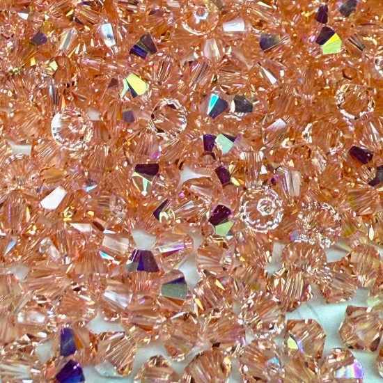 Picture of Swarovski 5328 Xilion Bead 4 mm Light Peach AB x100