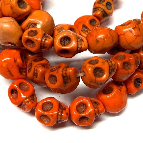 Bild von Synthetic Magnesite Skull 10x8mm Orange x10