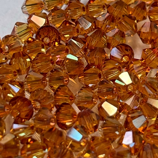 Picture of Swarovski 5328 Xilion Bead 4mm Crystal Apricot x100 