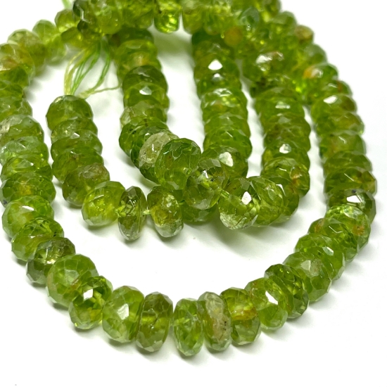 Picture of Peridot (natural) 5x2mm-7x5mm hand-cut faceted rondelle x35cm