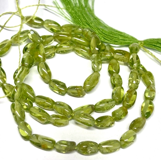 Picture of Peridot bead 3x6mm oval tube x38cm