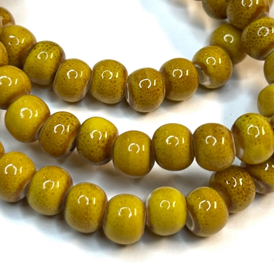 Picture of Porcelain bead 6mm round Yellow Ocher x32cm 