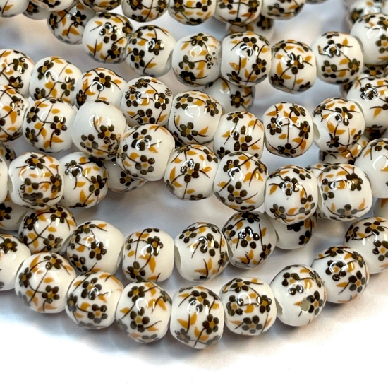 Picture of Porcelain bead 6mm round Brown flowers x32cm