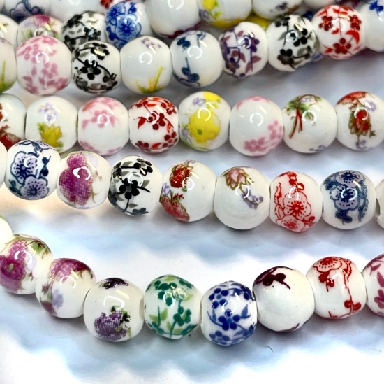 Picture of Porcelain bead 6mm round Mix flowers x32cm