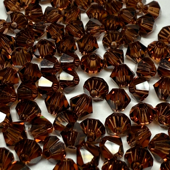 Picture of Swarovski 5301 Xilion Bead 4mm Smoked Topaz x100 